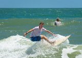 Surfer  St. Augustine beach scene at Vilano Beach : Florida, St. Augustine, Vilano Beach, beach, surfing