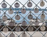 ILCE-6500-20180511-DSC01718  Donor name tags on fence overlooking Elliot Bay in Puget Sound : 2018, Pike Place Market, Seattle